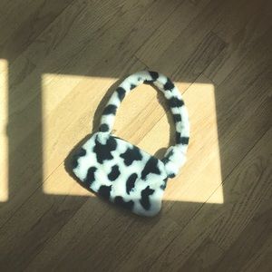 Fuzzy, soft cow print purse.